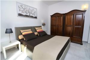 A bed or beds in a room at B&B Villa Genny a pochi passi dal mare