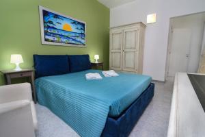 A bed or beds in a room at B&B Villa Genny a pochi passi dal mare
