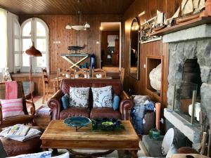 a living room with a couch and a table at A Villa by the Sea Bed & Breakfast in Vila Franca do Campo