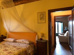 Postel nebo postele na pokoji v ubytování Agriturismo Podere Marchiano
