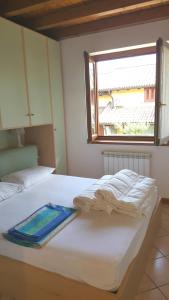 a bedroom with a bed with a tray on it at A due passi dalla spiaggia in Colico