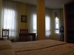 Postel nebo postele na pokoji v ubytování Hostal Orejas