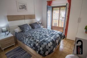 Postel nebo postele na pokoji v ubytování Cuencaloft Casita de la Luz