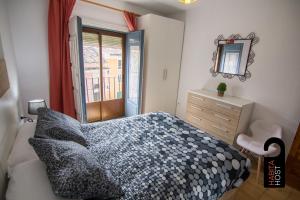 Postel nebo postele na pokoji v ubytování Cuencaloft Casita de la Luz