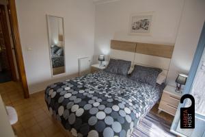 Postel nebo postele na pokoji v ubytování Cuencaloft Casita de la Luz