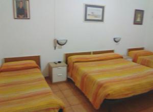 Voodi või voodid majutusasutuse Albergo Cavour SELF CHECK-IN toas