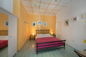 Posteľ alebo postele v izbe v ubytovaní Kredo B&B