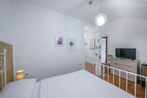 Posteľ alebo postele v izbe v ubytovaní Kredo B&B