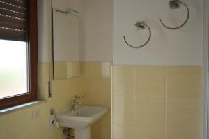 Kúpeľňa v ubytovaní Appartamenti Sole delle Aci