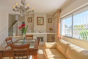 a living room with a table and a couch at Cubo's Villa Marieli Chilches in Chilches