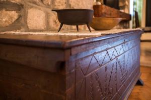 a wooden dresser with a bowl on top of it at Old Palace Apartment in Dubrovnik