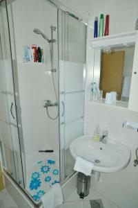 a bathroom with a sink and a shower at Barać in Kaštela