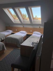Ένα ή περισσότερα κρεβάτια σε δωμάτιο στο ZAKĄTEK