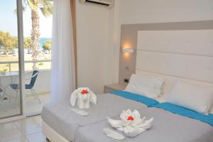 Krevet ili kreveti u jedinici u okviru objekta Costa Angela Seaside Resort