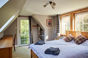 מיטה או מיטות בחדר ב-Glenalbyn Cottage