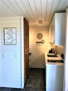 a kitchen with a sink and a counter top at Studio La Voile Blanche in Orient Bay French St Martin