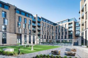 an exterior view of a building with rocks in the courtyard at Destiny Student - New Mill in Dublin