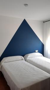 Postel nebo postele na pokoji v ubytování Apartments Mar de Tossa