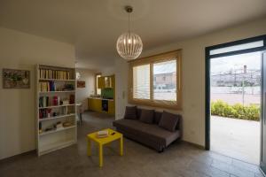 a living room with a couch and a table at La Villa delle Spezie in Marzamemi