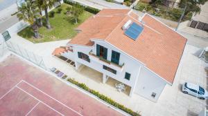 an overhead view of a white house with a red roof at La Villa delle Spezie in Marzamemi +78 photos