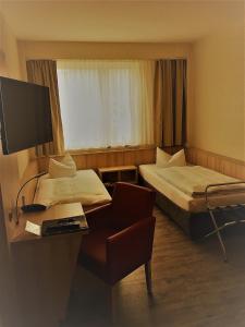 Rúm í herbergi á Rügen-Hotel