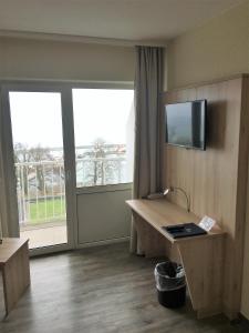 Sjónvarps- og/eða afþreyingartæki á Rügen-Hotel