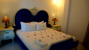 Letto o letti in una camera di Bacolet Beach Club