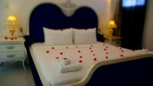 Letto o letti in una camera di Bacolet Beach Club