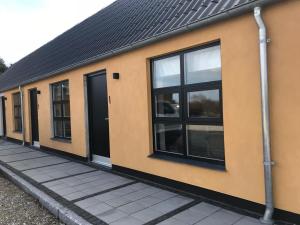 a row of windows on a building at Gl.Hastrup Guesthouse in Køge