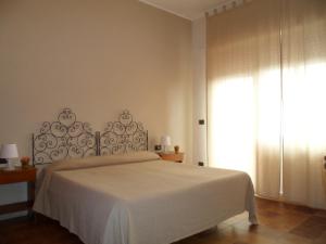 Łóżko lub łóżka w pokoju w obiekcie Hotel Panorama di Sicilia