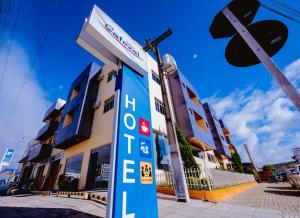 a gas station sign in front of a building at Cafezal Palace Hotel in Vitória da Conquista