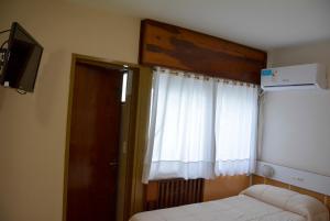 Postel nebo postele na pokoji v ubytování Hotel Menossi