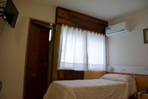 Postel nebo postele na pokoji v ubytování Hotel Menossi