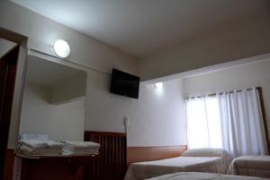 Postel nebo postele na pokoji v ubytování Hotel Menossi