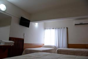Postel nebo postele na pokoji v ubytování Hotel Menossi