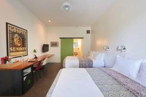Postel nebo postele na pokoji v ubytování Hotel San Jose