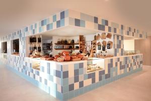 a kitchen filled with lots of different types of food at Iberostar Selection Sábila - Adults Only in Adeje