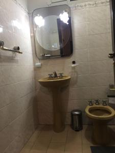 a bathroom with a sink and a toilet at Alquiler Temporario Jujuy 2 in San Salvador de Jujuy