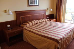 Ένα ή περισσότερα κρεβάτια σε δωμάτιο στο Hotel La Dolce Vita