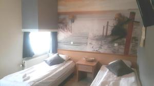 Ένα ή περισσότερα κρεβάτια σε δωμάτιο στο Hotel Velsen