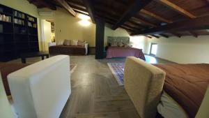 a living room with two beds and a couch at Casa Francesconi in Pietra Rossa