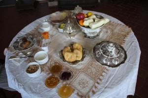 a table with a plate of food on top of it at Villa Eugenia in Livorno