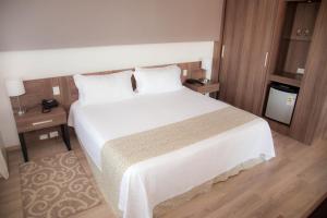 Postel nebo postele na pokoji v ubytování 7 Saltos Resort + 32 fotografií