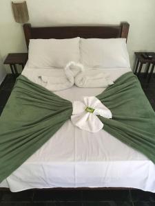 מיטה או מיטות בחדר ב-Pousada Conde do Mar