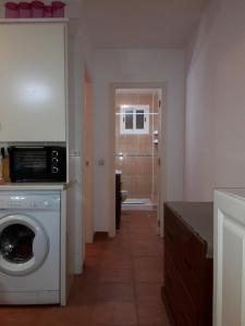 Kuchyňa alebo kuchynka v ubytovaní naturist apartament + 23 fotografií