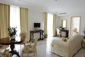 a living room with a couch and a table at Hotel Villa Fraulo in Ravello