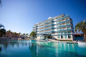 a large swimming pool in front of a building at Oceania Park Hotel Spa & Convention by RB Hotelaria in Florianópolis