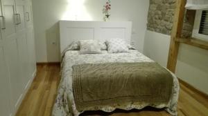 Posteľ alebo postele v izbe v ubytovaní La Casa de Santa Olalla