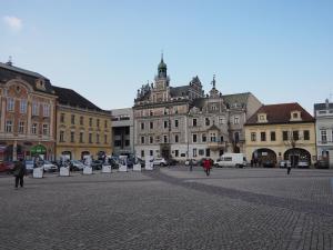 a city square with buildings and people walking around at Pension Inspirace a Wellness in Kolín