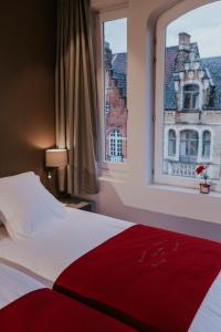 Postel nebo postele na pokoji v ubytování Hotel New Regina
